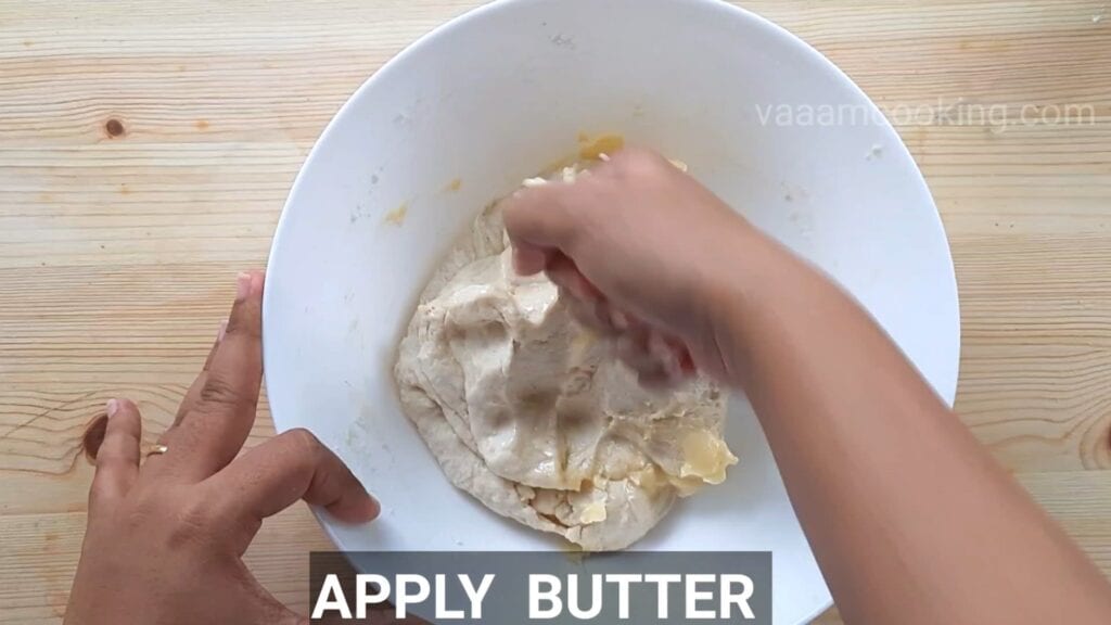 Eggless-doughnuts-recipe-eggless-donut-recipe-dough-apply-butter