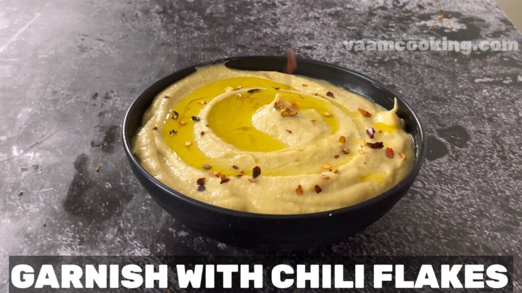 hummus without tahini garnish with chili flakes